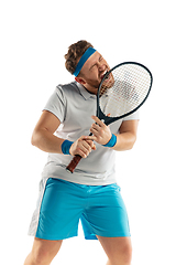 Image showing Funny emotions of professional tennis player isolated on white studio background, excitement in game