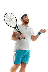 Image showing Funny emotions of professional tennis player isolated on white studio background, excitement in game