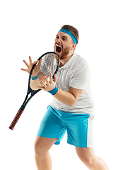 Image showing Funny emotions of professional tennis player isolated on white studio background, excitement in game