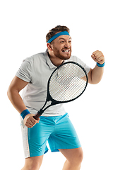 Image showing Funny emotions of professional tennis player isolated on white studio background, excitement in game