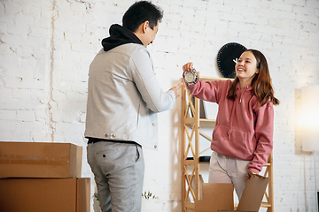 Image showing New property owners, young couple moving to new home, apartment, look happy