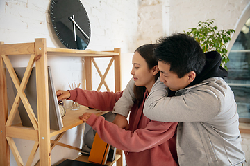 Image showing New property owners, young couple moving to new home, apartment, look happy