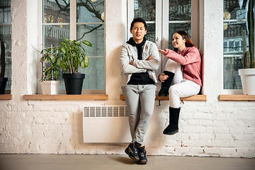 Image showing New property owners, young couple moving to new home, apartment, look happy