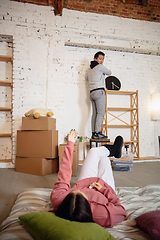 Image showing New property owners, young couple moving to new home, apartment, look happy