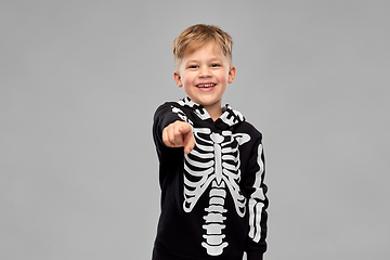 Image showing boy in costume of skeleton pointing to camera