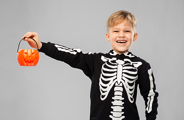 Image showing happy boy in halloween costume with jack-o-lantern