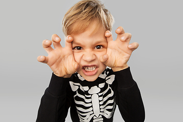 Image showing boy in halloween costume of skeleton making faces