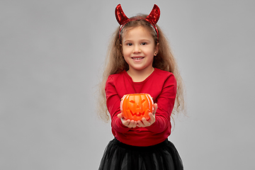 Image showing girl in halloween costume with jack-o-lantern