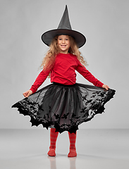 Image showing happy girl in black witch hat on halloween