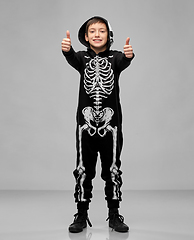 Image showing boy in costume of skeleton showing thumbs up