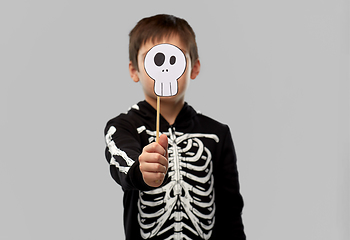 Image showing boy in halloween costume with scull accessory