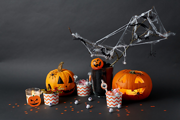 Image showing pumpkins, candies and halloween decorations