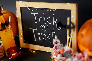 Image showing pumpkins, candies and halloween decorations