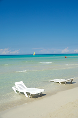 Image showing Sunloungers at exotic beach