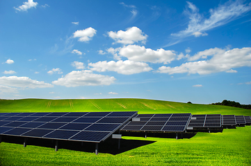 Image showing Rows of solar panels and green nature