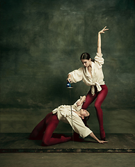 Image showing Two young female ballet dancers like duelists with swords. Ballet and contemporary choreography concept. Creative art photo.