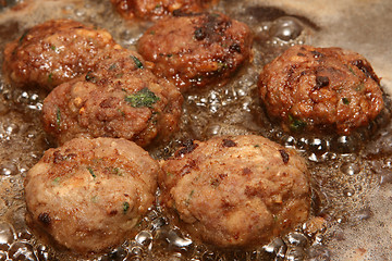 Image showing meatballs in hot oil