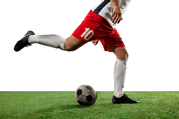 Image showing Close up legs of professional soccer, football player fighting for ball on field isolated on white background