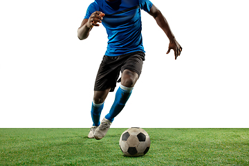 Image showing Close up legs of professional soccer, football player fighting for ball on field isolated on white background