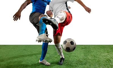 Image showing Close up legs of professional soccer, football players fighting for ball on field isolated on white background