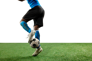 Image showing Close up legs of professional soccer, football player fighting for ball on field isolated on white background