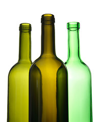 Image showing Three empty wine bottles for recycling