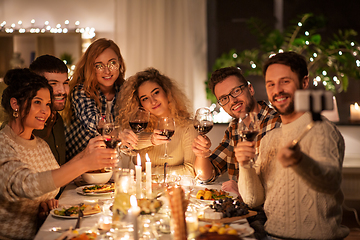 Image showing friends taking selfie at christmas dinner party