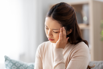 Image showing sick asian woman having headache at home