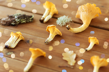 Image showing chanterelles on wooden background