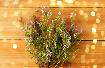 Image showing heather bush on wooden table