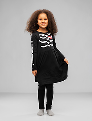 Image showing girl in black halloween dress with skeleton bones