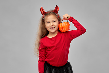 Image showing girl in halloween costume with jack-o-lantern