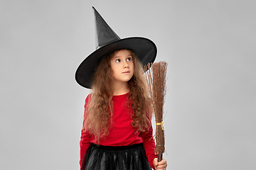 Image showing girl in black witch hat with broom on halloween