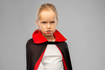 Image showing girl in dracula costume with cape on halloween