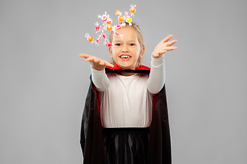 Image showing girl in halloween costume of dracula with candies