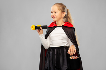 Image showing girl in halloween costume of dracula with candies