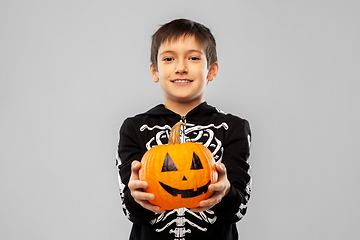 Image showing boy in halloween costume of skeleton with pumpkin