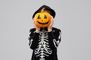 Image showing boy in halloween costume with jack-o-lantern