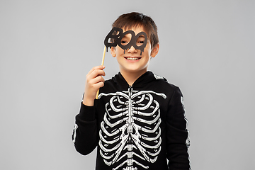 Image showing boy in halloween costume of skeleton with props