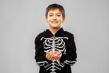 Image showing boy in halloween costume of skeleton with candies