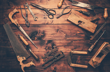 Image showing Assortment of old and rusty tools in workshop.