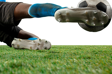 Image showing Close up legs of professional soccer, football player fighting for ball on field isolated on white background