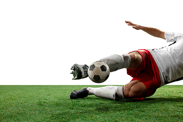 Image showing Close up legs of professional soccer, football player fighting for ball on field isolated on white background