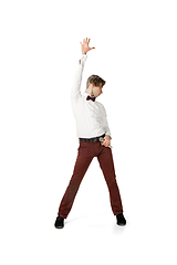 Image showing Happy young man dancing in casual clothes or suit, remaking legendary moves of celebrity from culture history