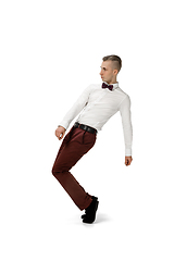 Image showing Happy young man dancing in casual clothes or suit, remaking legendary moves of celebrity from culture history