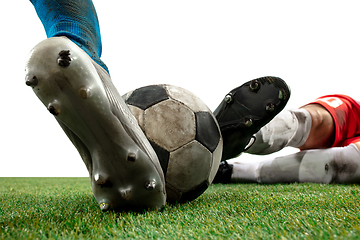 Image showing Close up legs of professional soccer, football players fighting for ball on field isolated on white background