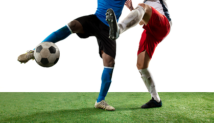 Image showing Close up legs of professional soccer, football players fighting for ball on field isolated on white background