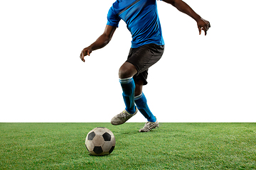 Image showing Close up legs of professional soccer, football player fighting for ball on field isolated on white background