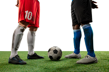 Image showing Close up legs of professional soccer, football players fighting for ball on field isolated on white background