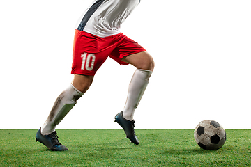 Image showing Close up legs of professional soccer, football player fighting for ball on field isolated on white background